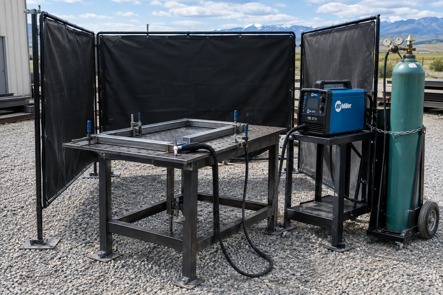 Outdoor TIG welding station with anchored wind screens and a secured argon cylinder